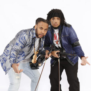 two men holding violins