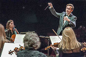 director leading an orchestra