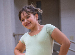 a young girl in ballet class