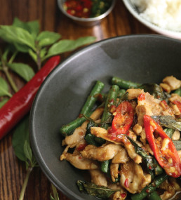 a pan of thai food on a table
