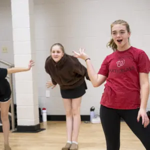 Girls practicing musical theater.
