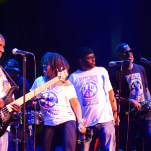 EU band members on stage.