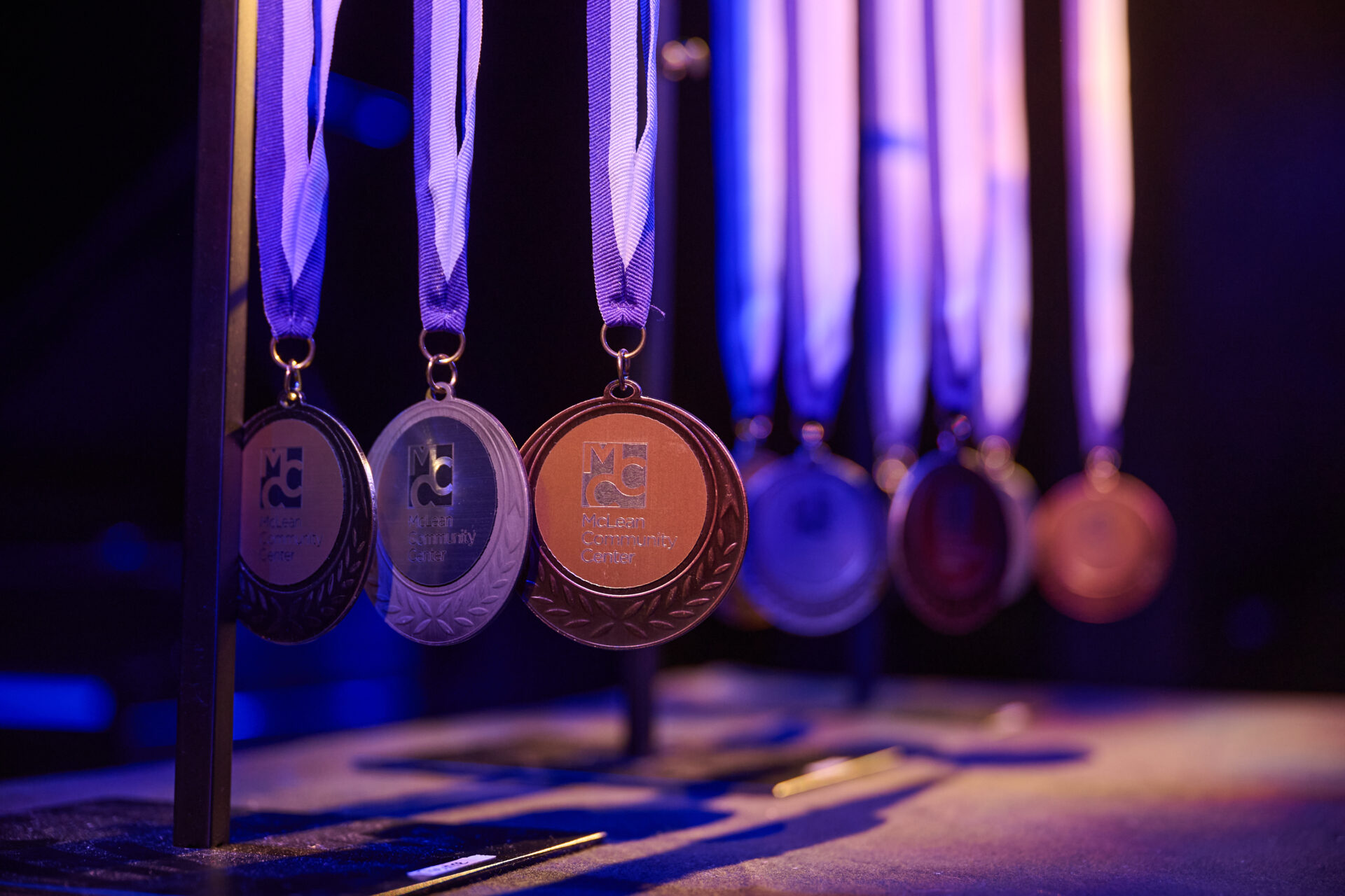 Macdonald award medals hanging over a table.