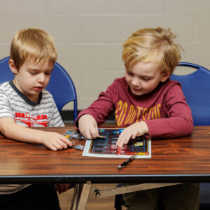 Boys putting together a circuit