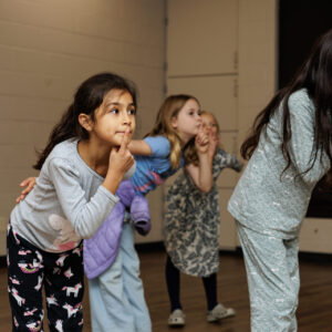 Girls in an improv class making faces