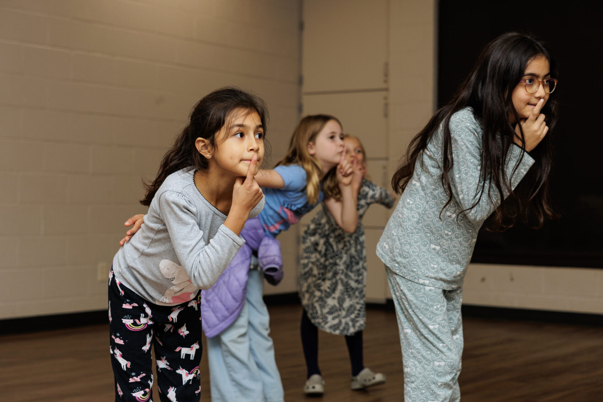Girls in an improv class making faces