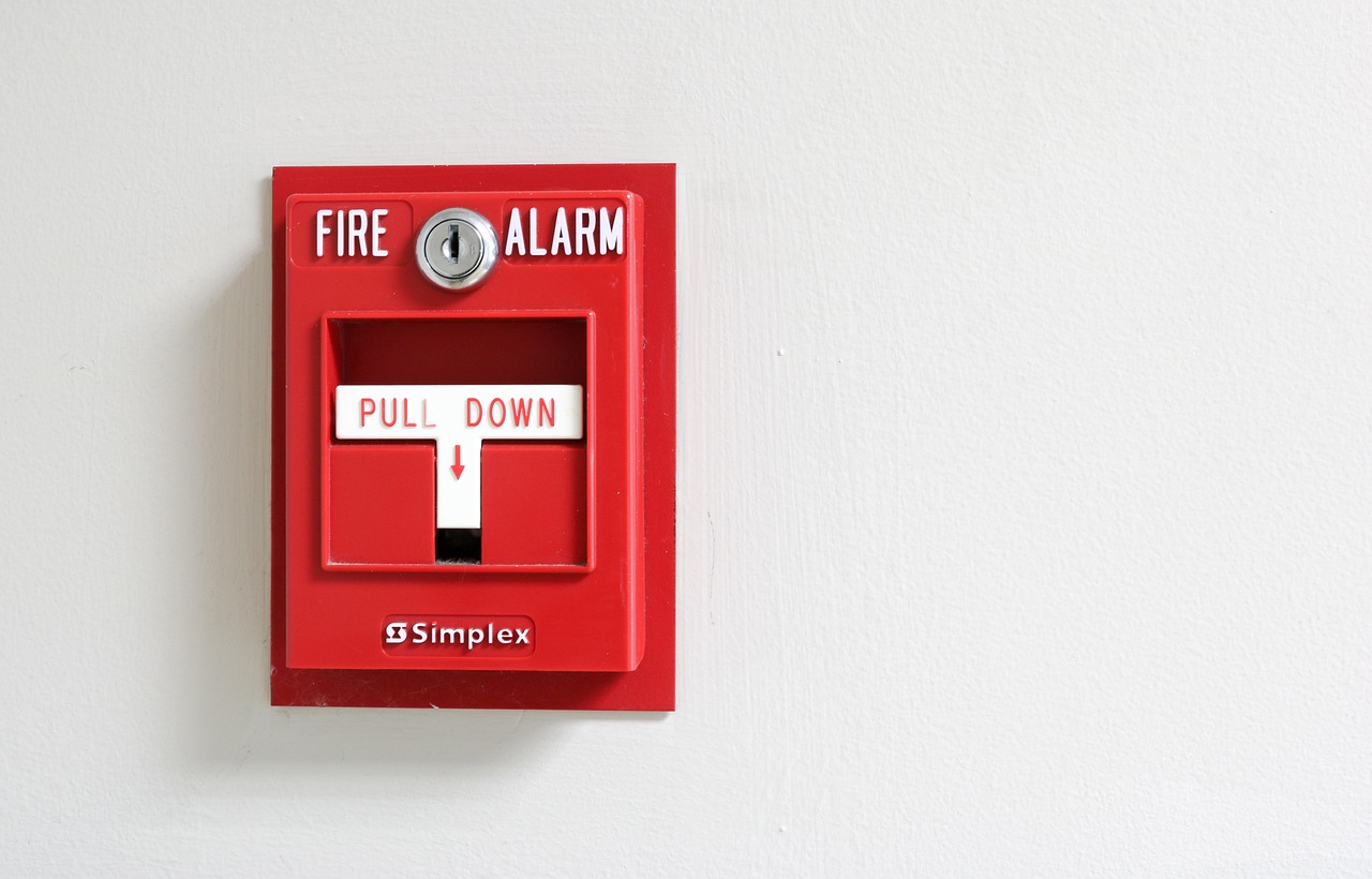 Fire alarm on a blank wall